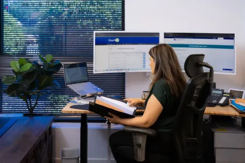 Lauraine Evans working on a computer