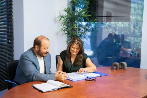 Phil Testa and Lauraine Evans working on a case